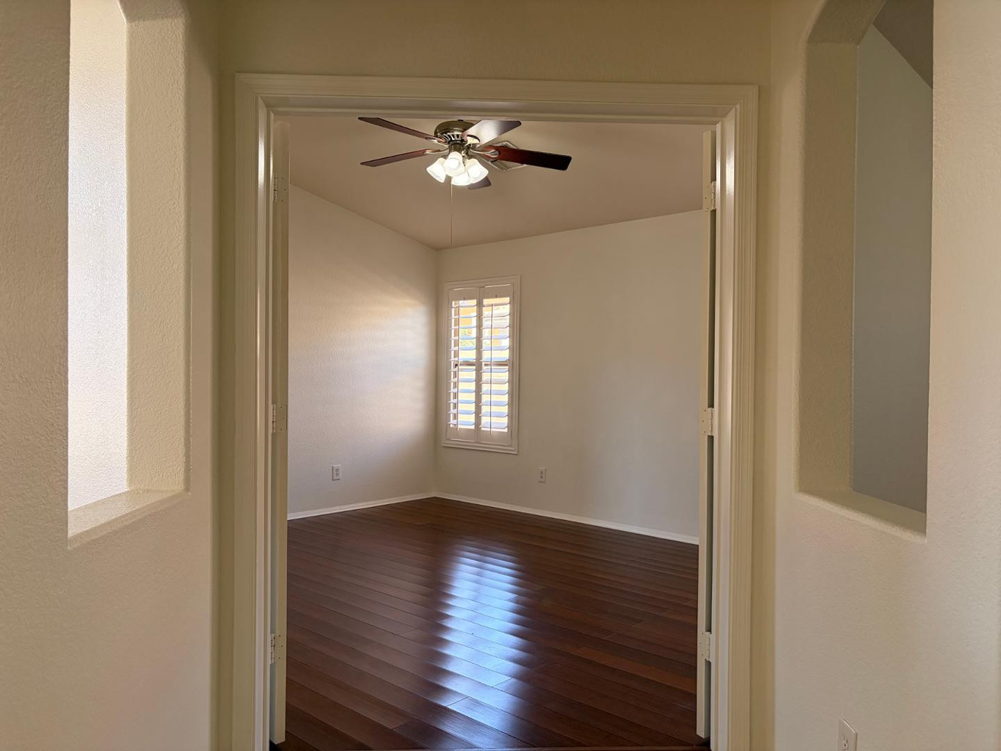 3872 East Simpson Road Gilbert, AZ 85297 - Photo 21 of 25 a view of an empty room with wooden floor and a window