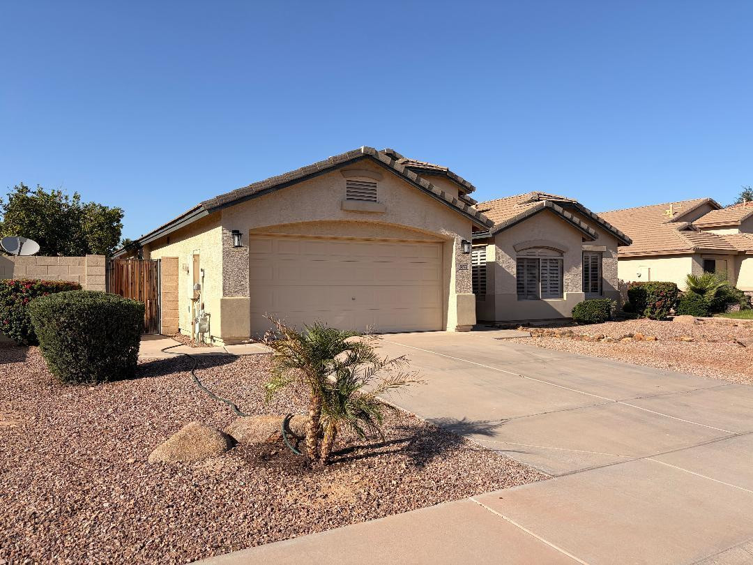 3872 East Simpson Road Gilbert, AZ 85297 - Photo 3 of 25 a view of a house with a yard