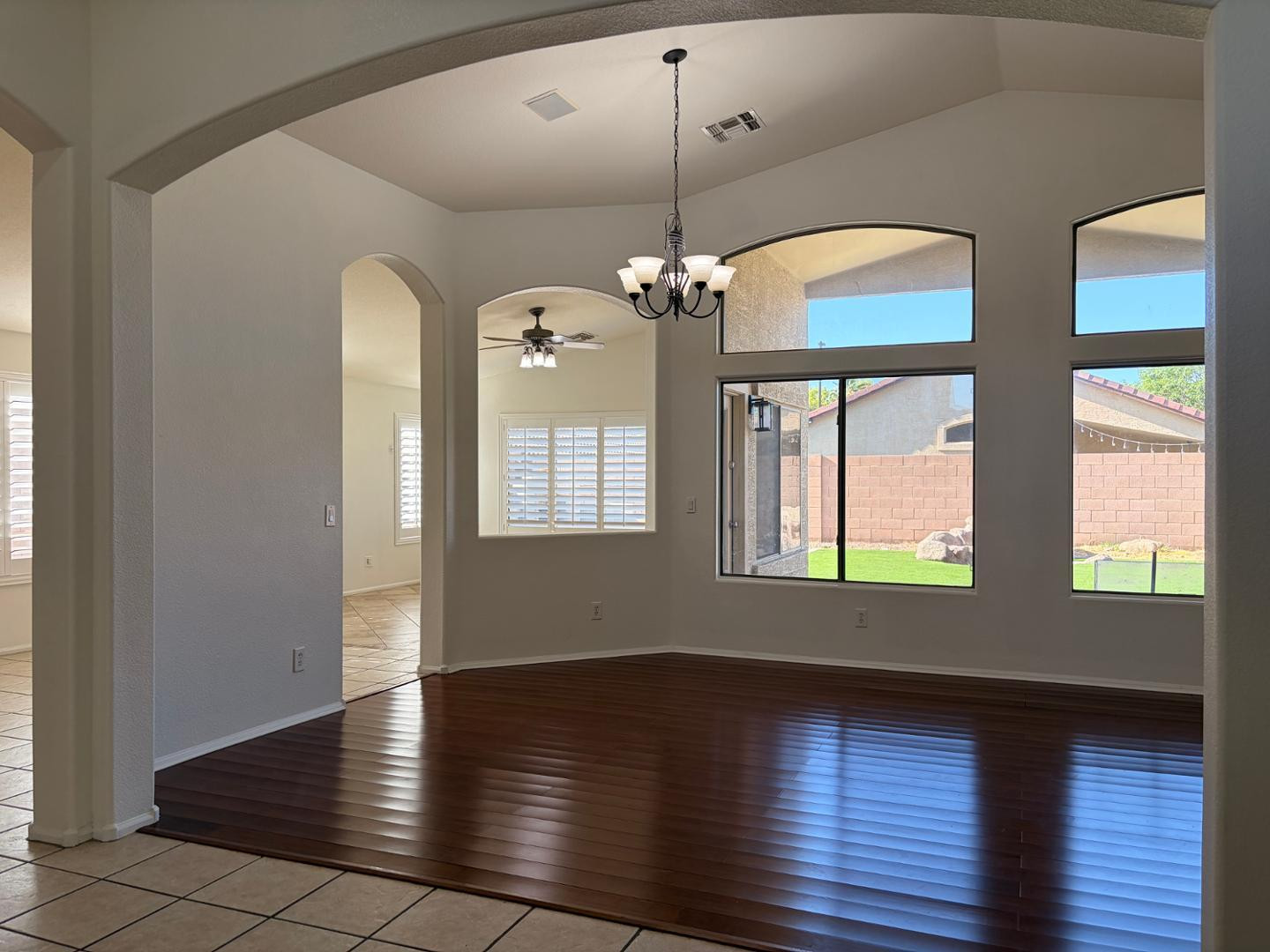 3872 East Simpson Road Gilbert, AZ 85297 - Photo 7 of 25 an empty room with wooden floor and windows