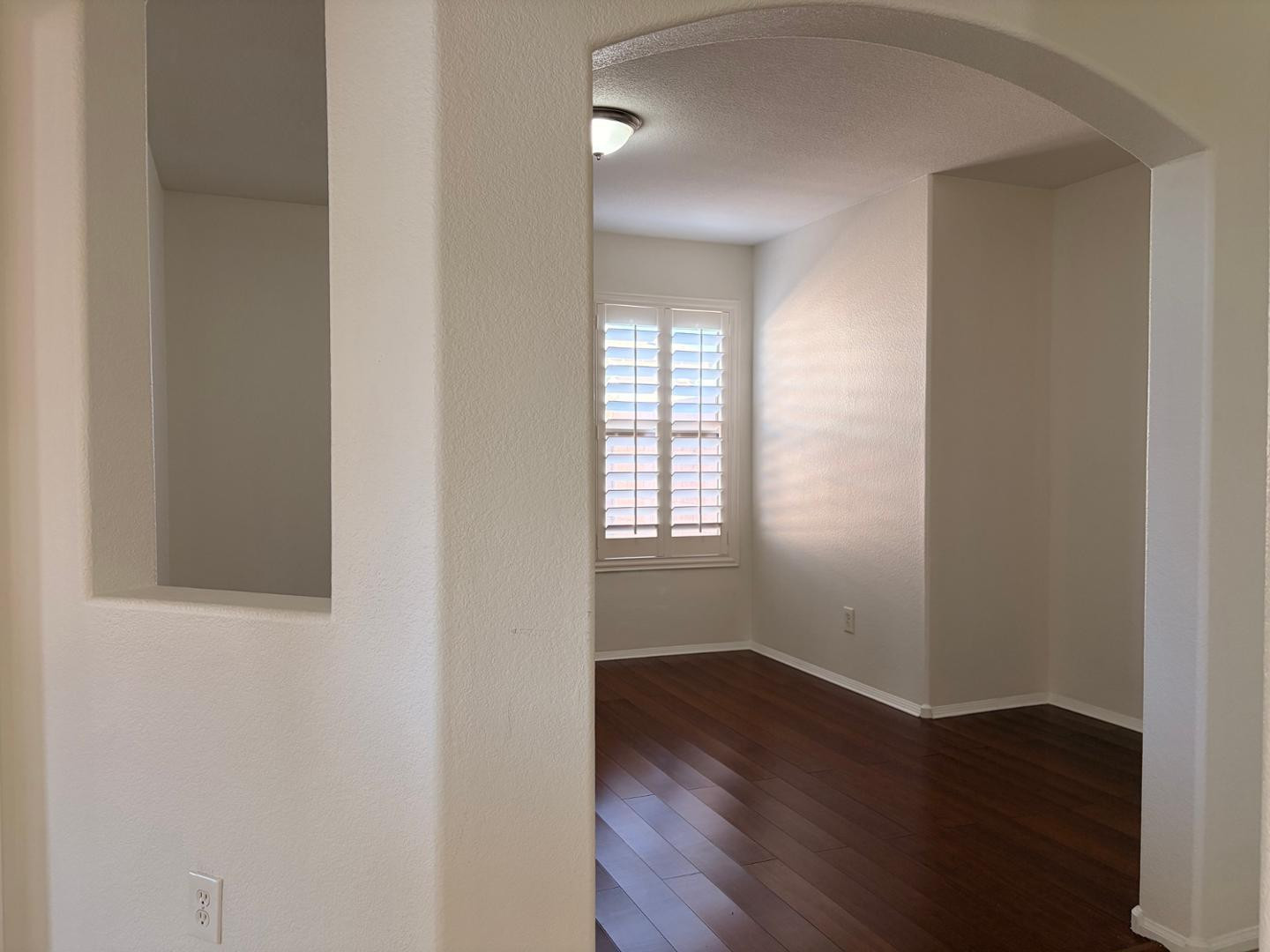 3872 East Simpson Road Gilbert, AZ 85297 - Photo 10 of 25 an empty room with wooden floor and windows