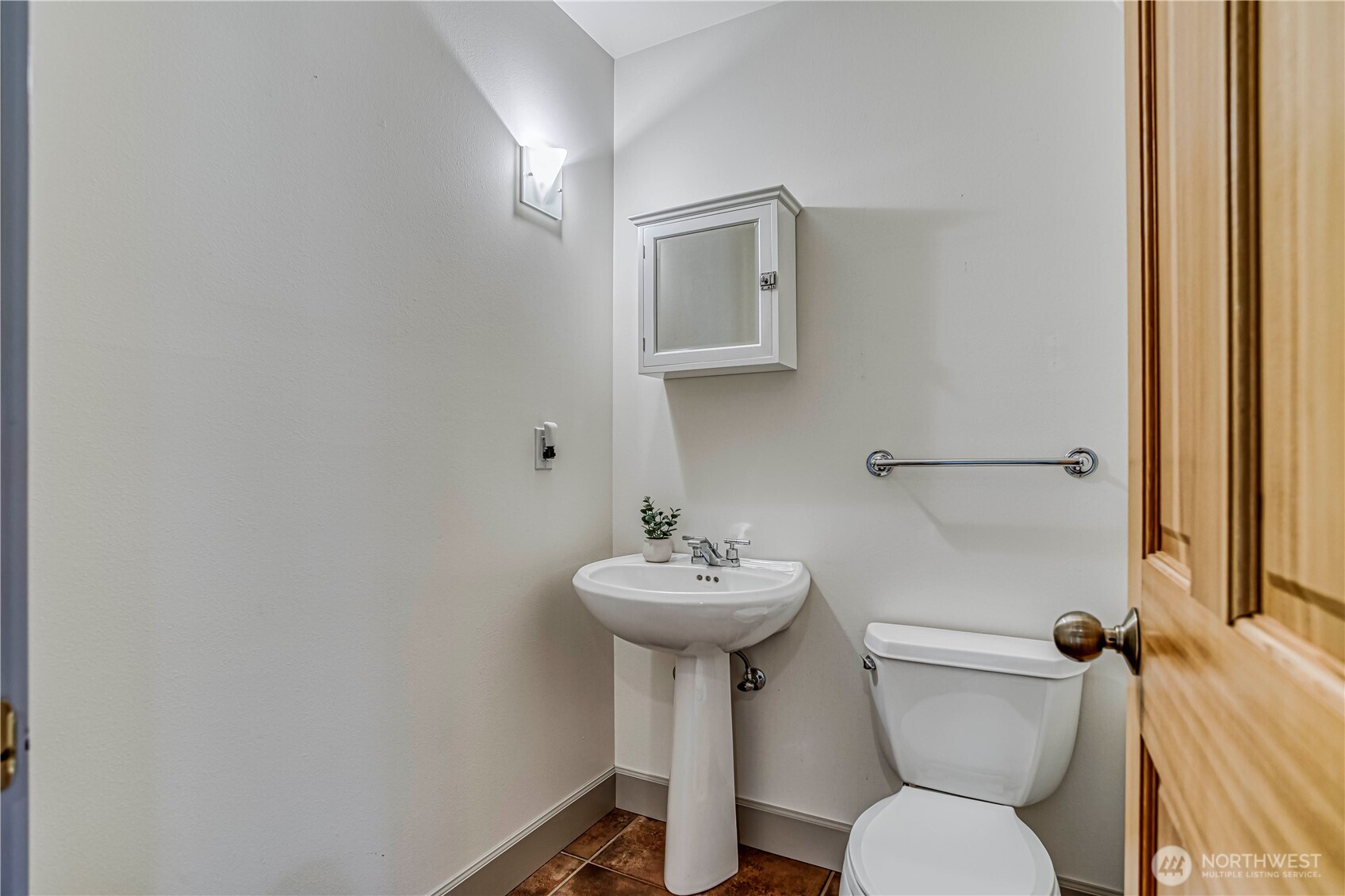 7580 Icicle Road Leavenworth, WA 98826 - Photo 15 of 38 a bathroom with a sink mirror toilet and a mirror