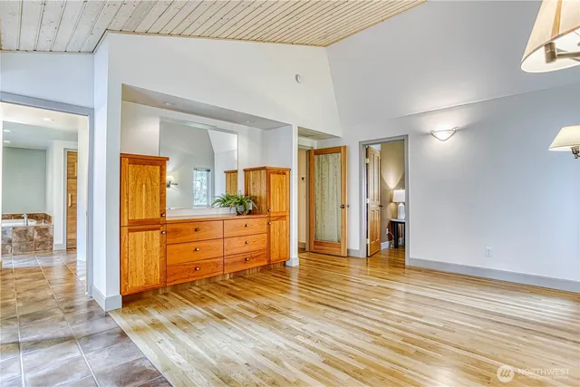 a large bathroom with a sink and a mirror