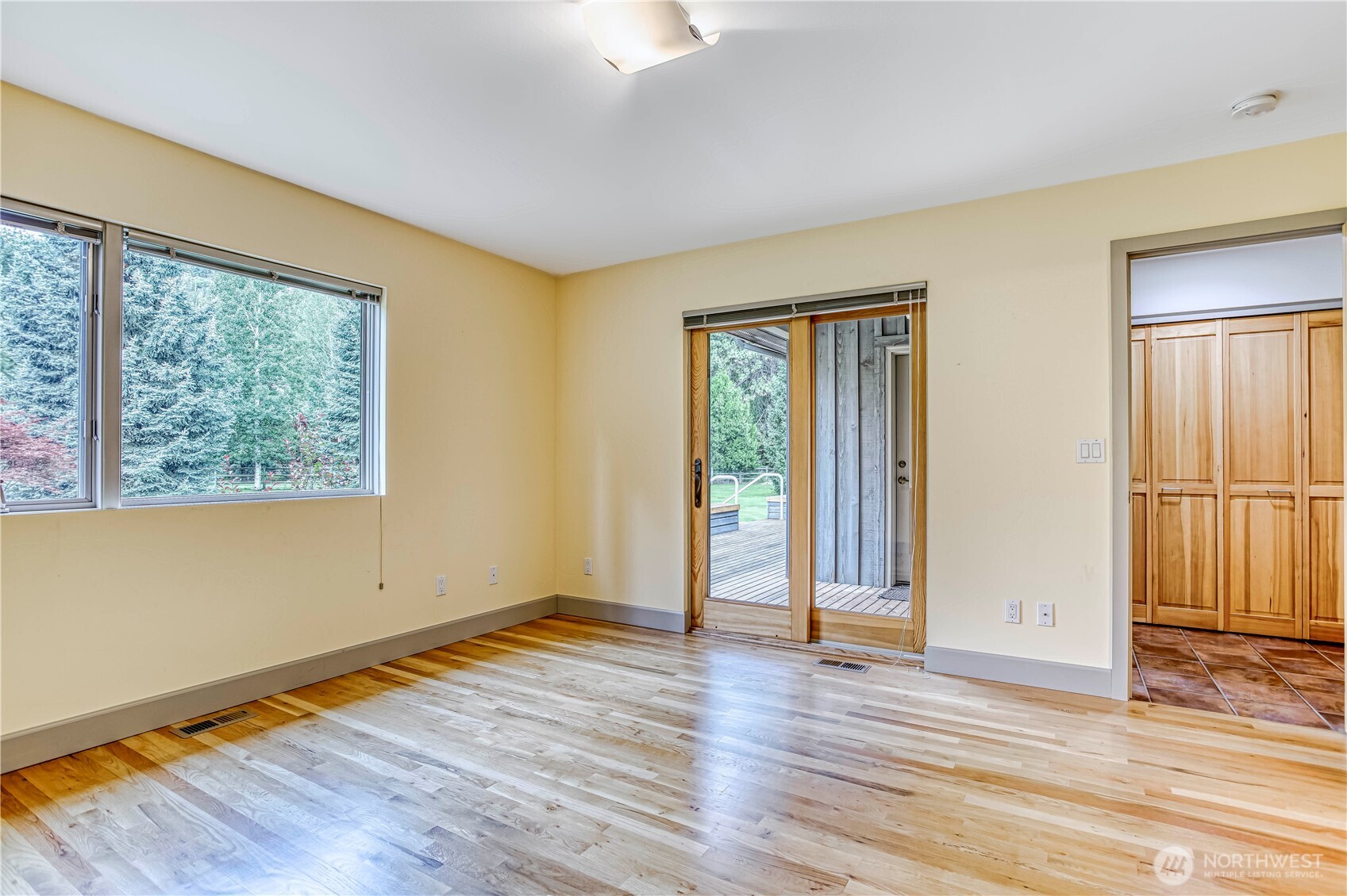 7580 Icicle Road Leavenworth, WA 98826 - Photo 22 of 38 a view of an empty room with wooden floor and a window