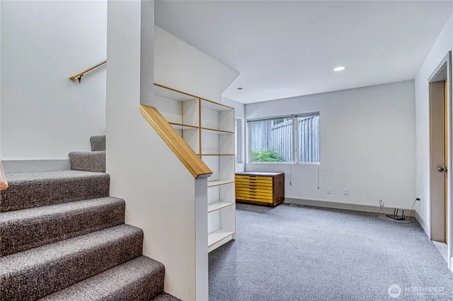 a view of a kitchen with wooden floor and a sink