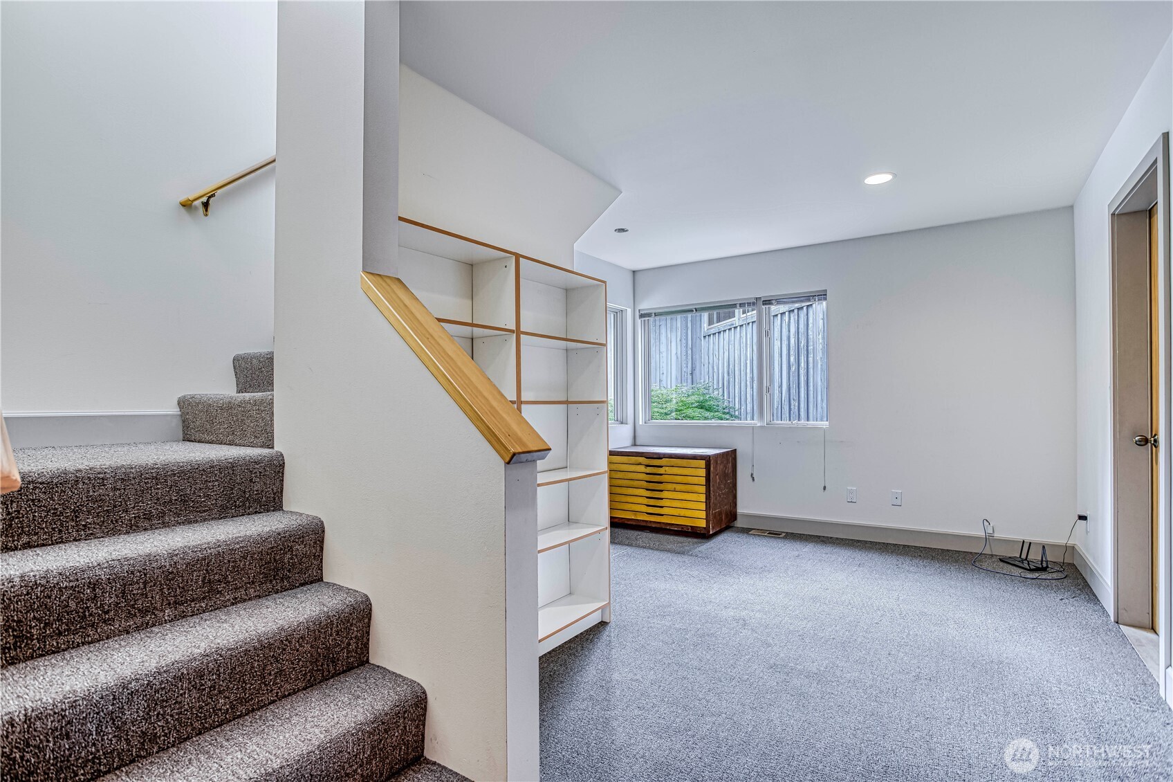 7580 Icicle Road Leavenworth, WA 98826 - Photo 25 of 38 a view of an empty room with wooden floor and stairs