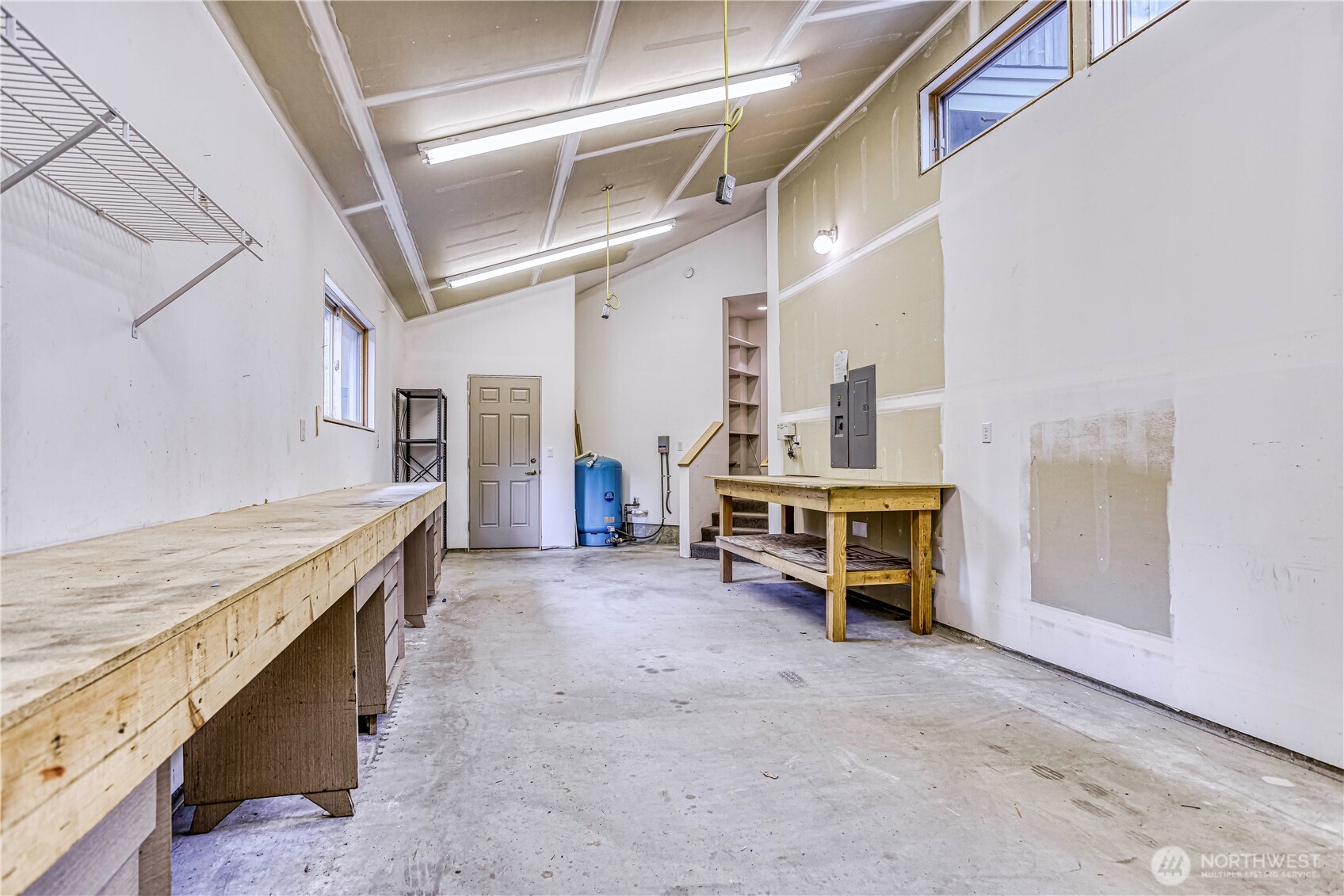 7580 Icicle Road Leavenworth, WA 98826 - Photo 30 of 38 a living room with stainless steel appliances kitchen island granite countertop a sink and cabinets