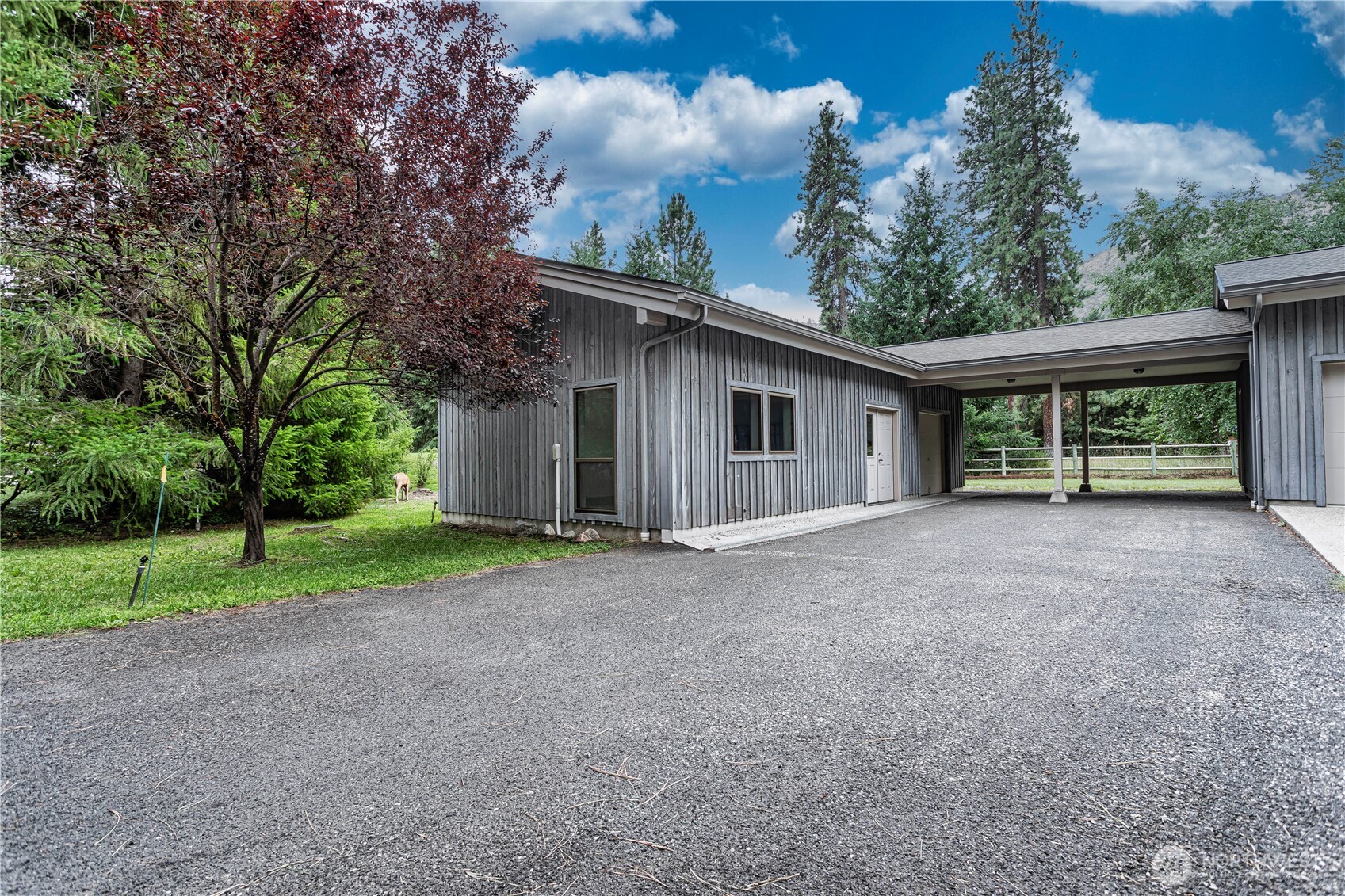 7580 Icicle Road Leavenworth, WA 98826 - Photo 32 of 38 a view of a house with a yard and garage