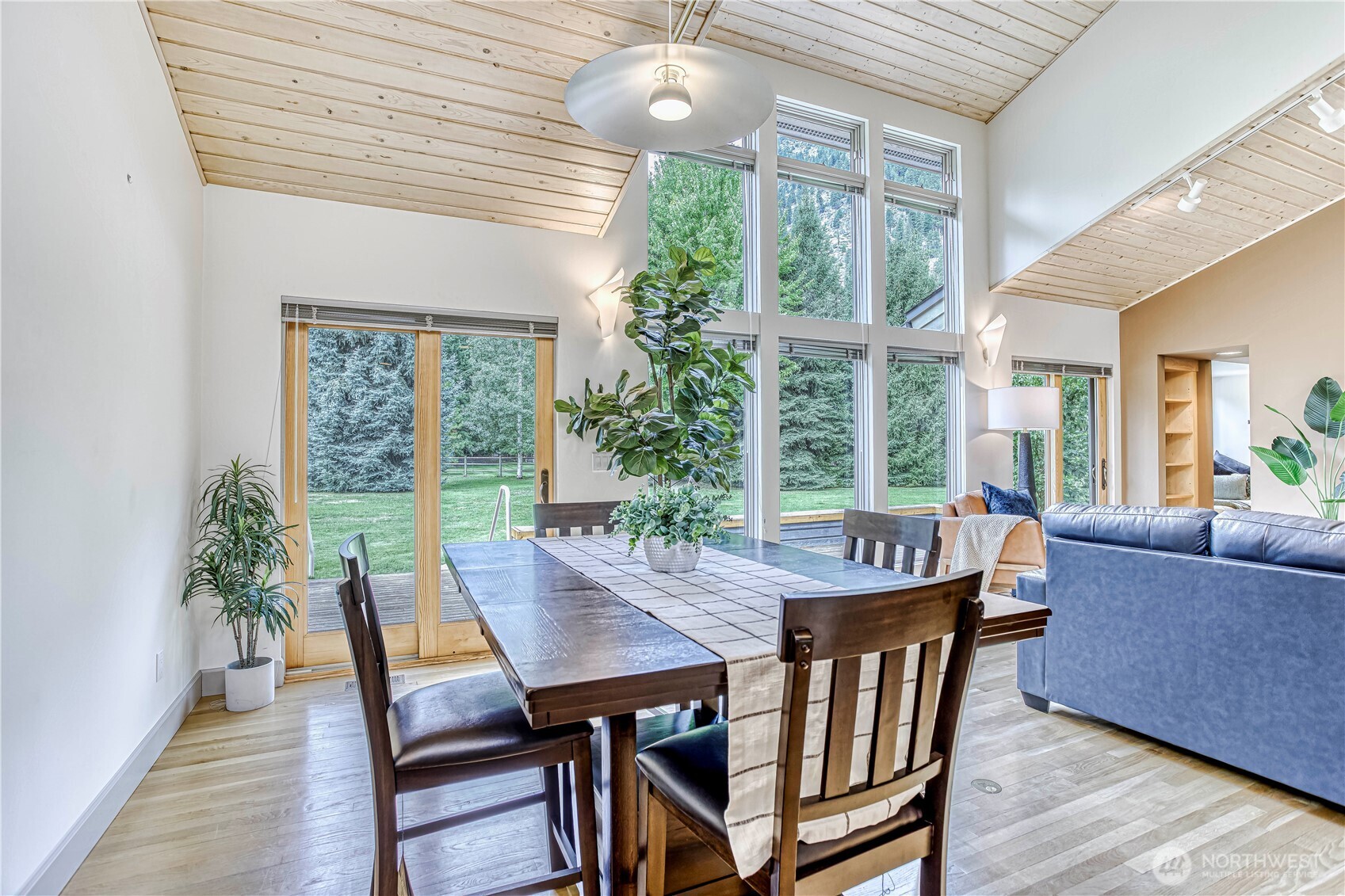 7580 Icicle Road Leavenworth, WA 98826 - Photo 7 of 38 a view of a dining room with furniture window and wooden floor