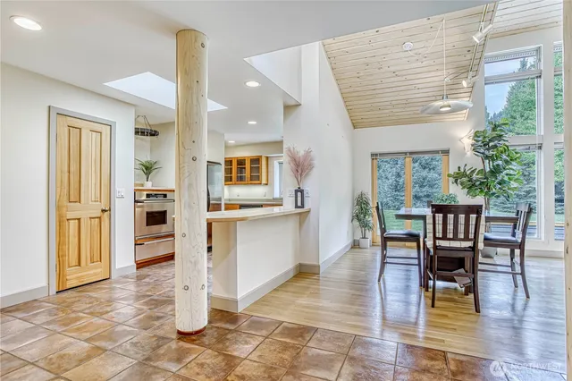 a view of a dining room kitchen with furniture and wooden floor