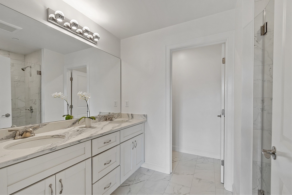 206 West Main Street, Unit 8 Georgetown, MA 01833 - Photo 18 of 38 a bathroom with double sink and a mirror