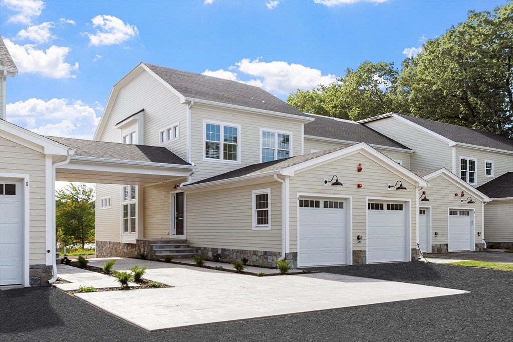 206 West Main Street, Unit 8 Georgetown, MA 01833 - Photo 2 of 38 a front view of a house with a yard