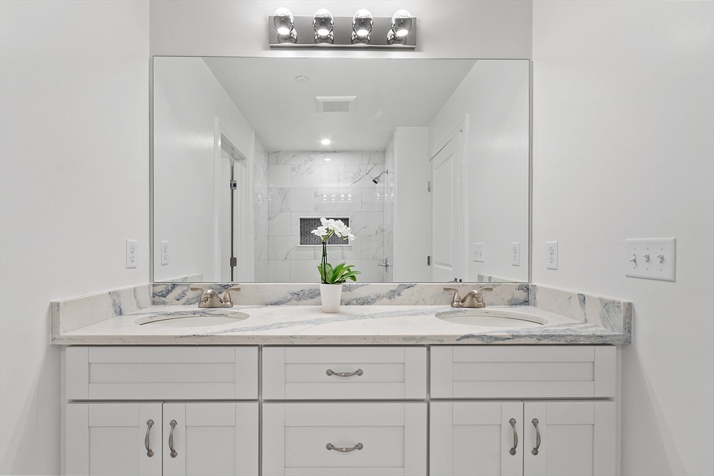 206 West Main Street, Unit 8 Georgetown, MA 01833 - Photo 22 of 38 a bathroom with a sink double vanity and a mirror