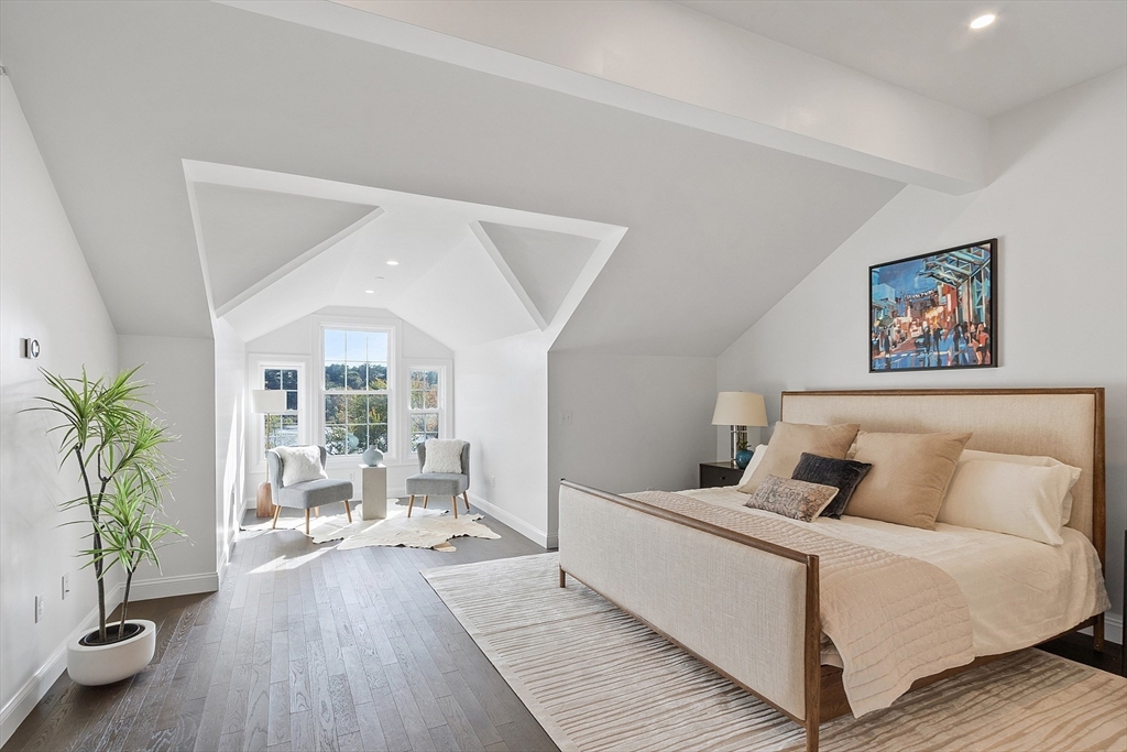 206 West Main Street, Unit 8 Georgetown, MA 01833 - Photo 24 of 38 a bedroom with a large bed and a wooden floor