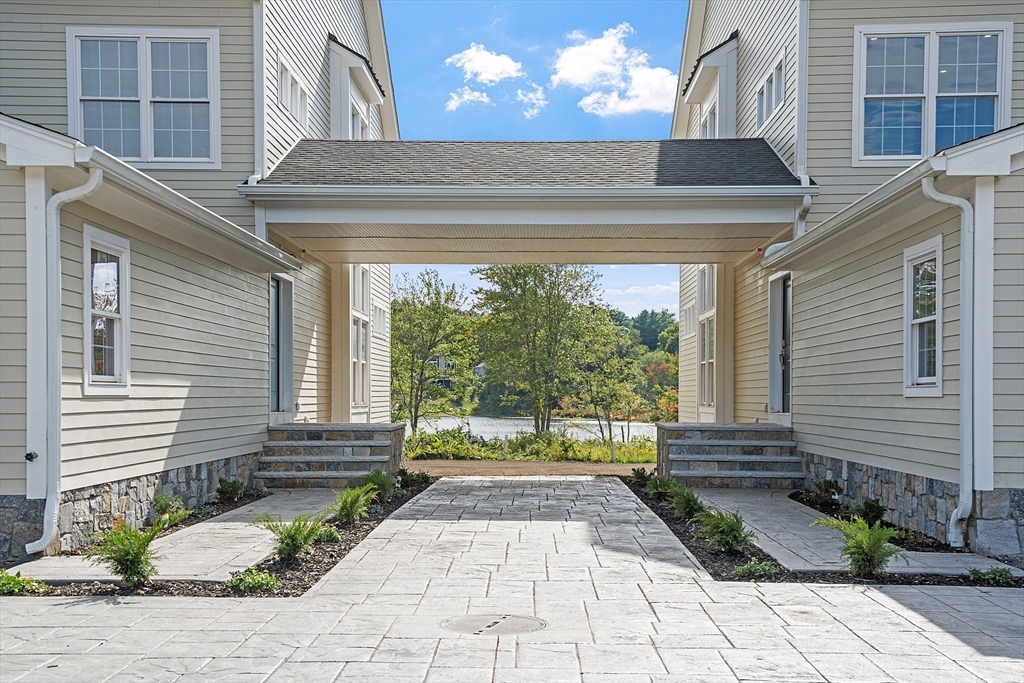 206 West Main Street, Unit 8 Georgetown, MA 01833 - Photo 3 of 38 a front view of a house with a yard