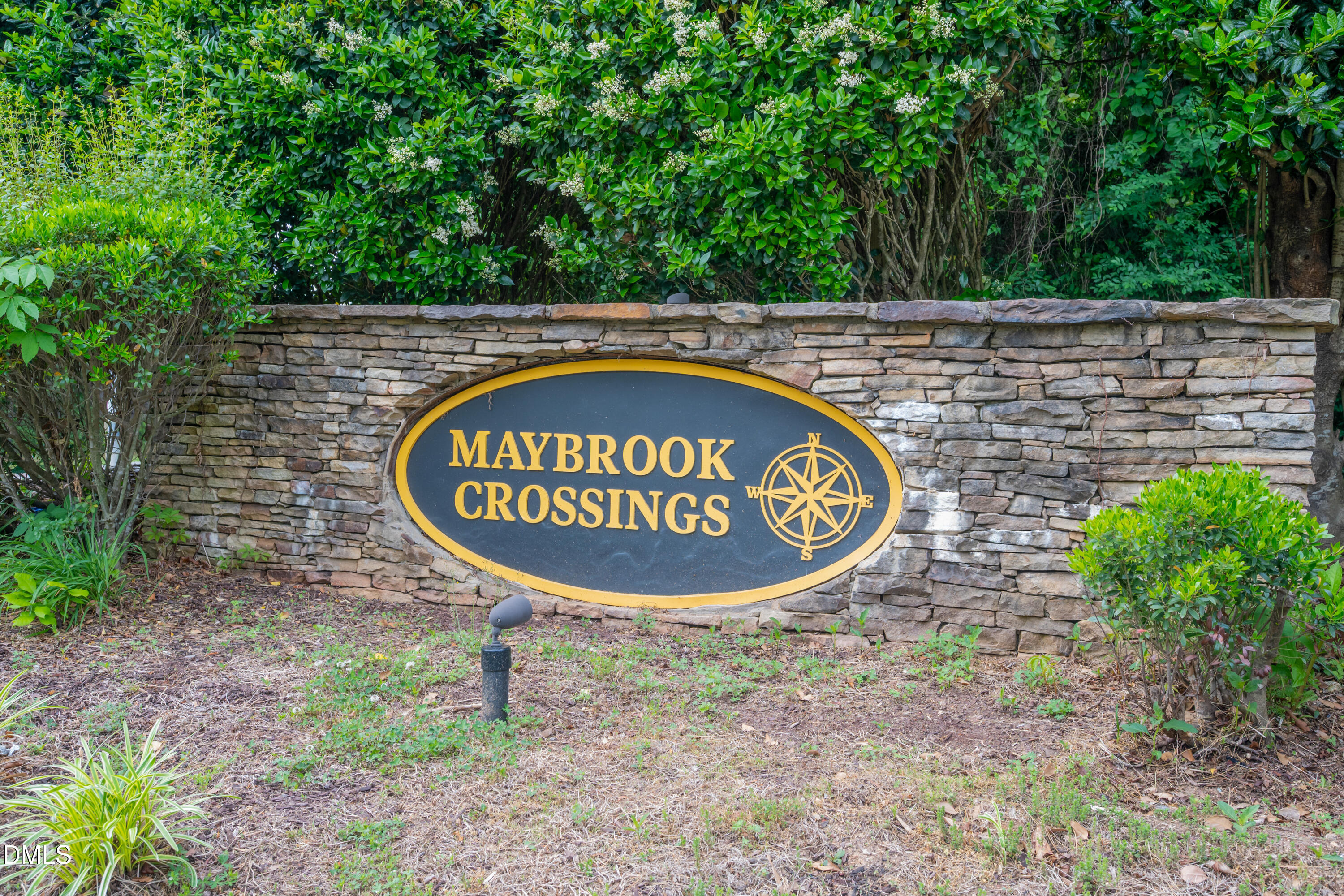 1532 Pebble Ridge Drive Raleigh, NC 27610 - Photo 2 of 40 a sign that is sitting on a brick wall