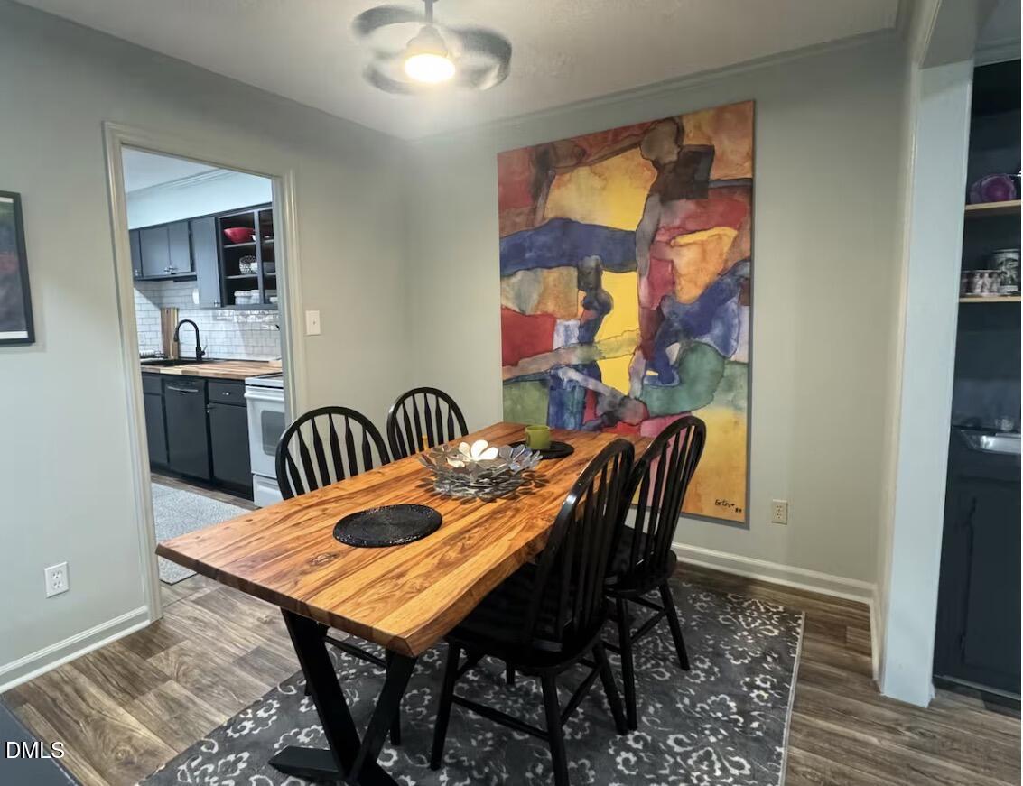 6369 New Market Way Raleigh, NC 27615 - Photo 5 of 14 a view of a dining room with furniture
