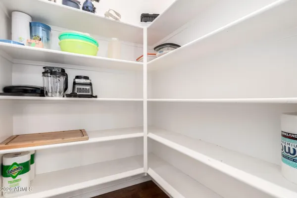 a bedroom with a bed and a television