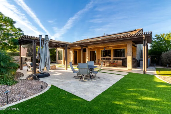 a view of a swimming pool with outdoor seating