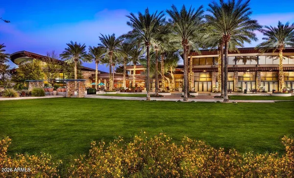 an outdoor space with swimming pool and furniture