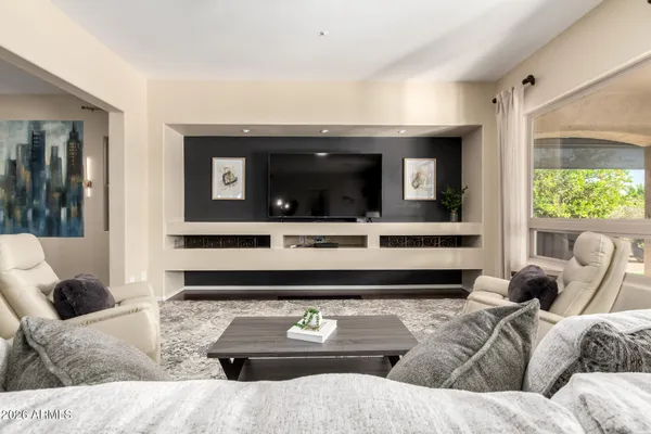 a living room with furniture and a large window