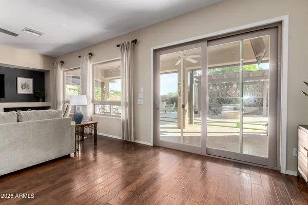 a kitchen with stainless steel appliances kitchen island granite countertop a kitchen island a stove a table and chairs