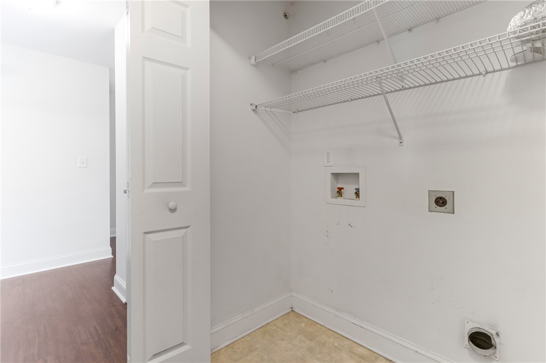 725 Lookover Drive Anderson, SC 29621 - Photo 25 of 31 Functional utility space features hookups, built-in wire shelving, and durable vinyl flooring.