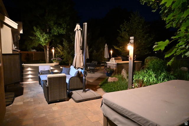 314 Brown Farm Lane Draper, UT 84020 - Photo 51 of 57 Expansive paver patio with tiered hardscaping and integrated step lighting