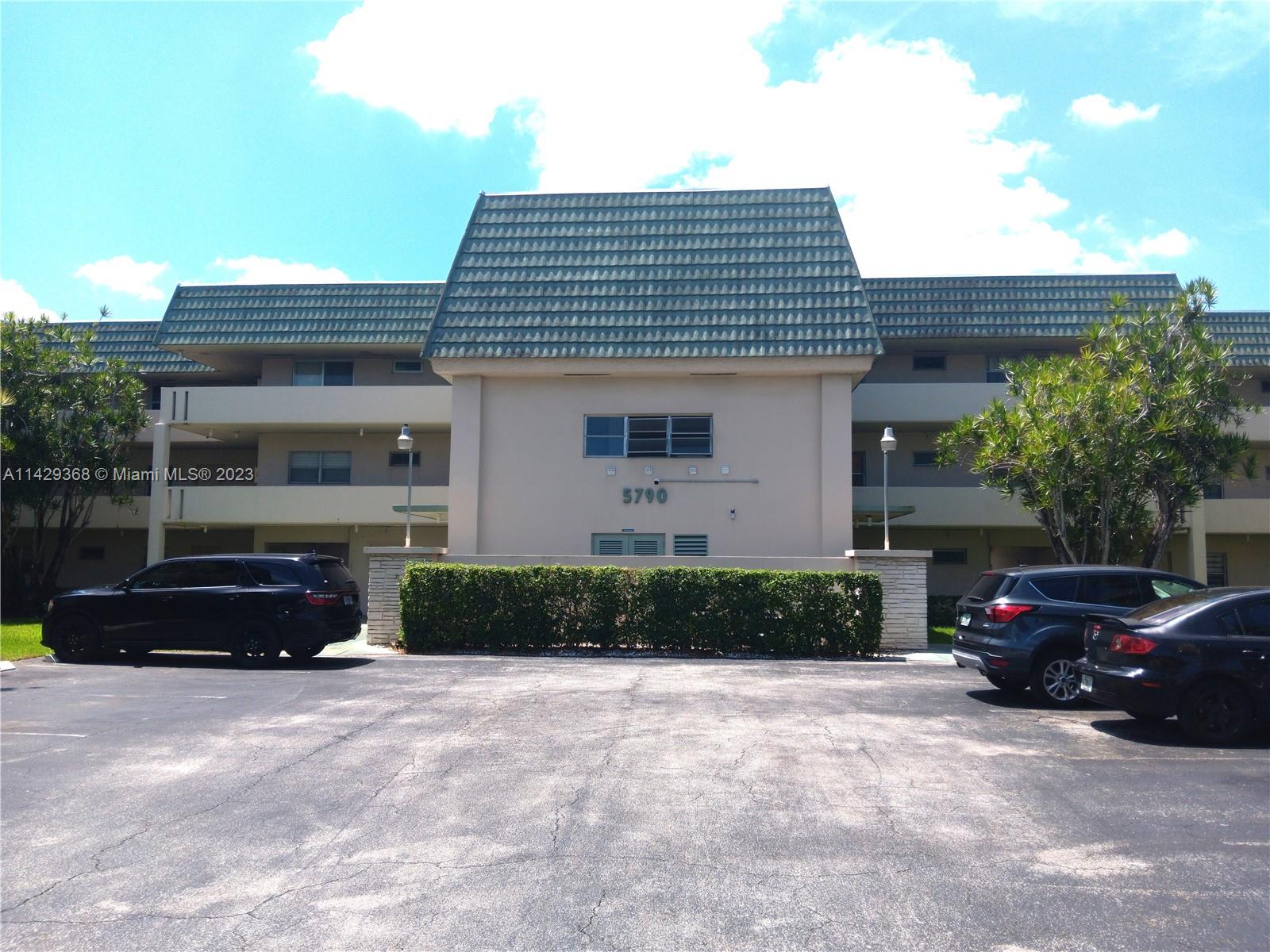 5790 Stirling Road, Unit 311 Hollywood, FL 33021 - Photo 1 of 36 a front view of a house with a yard