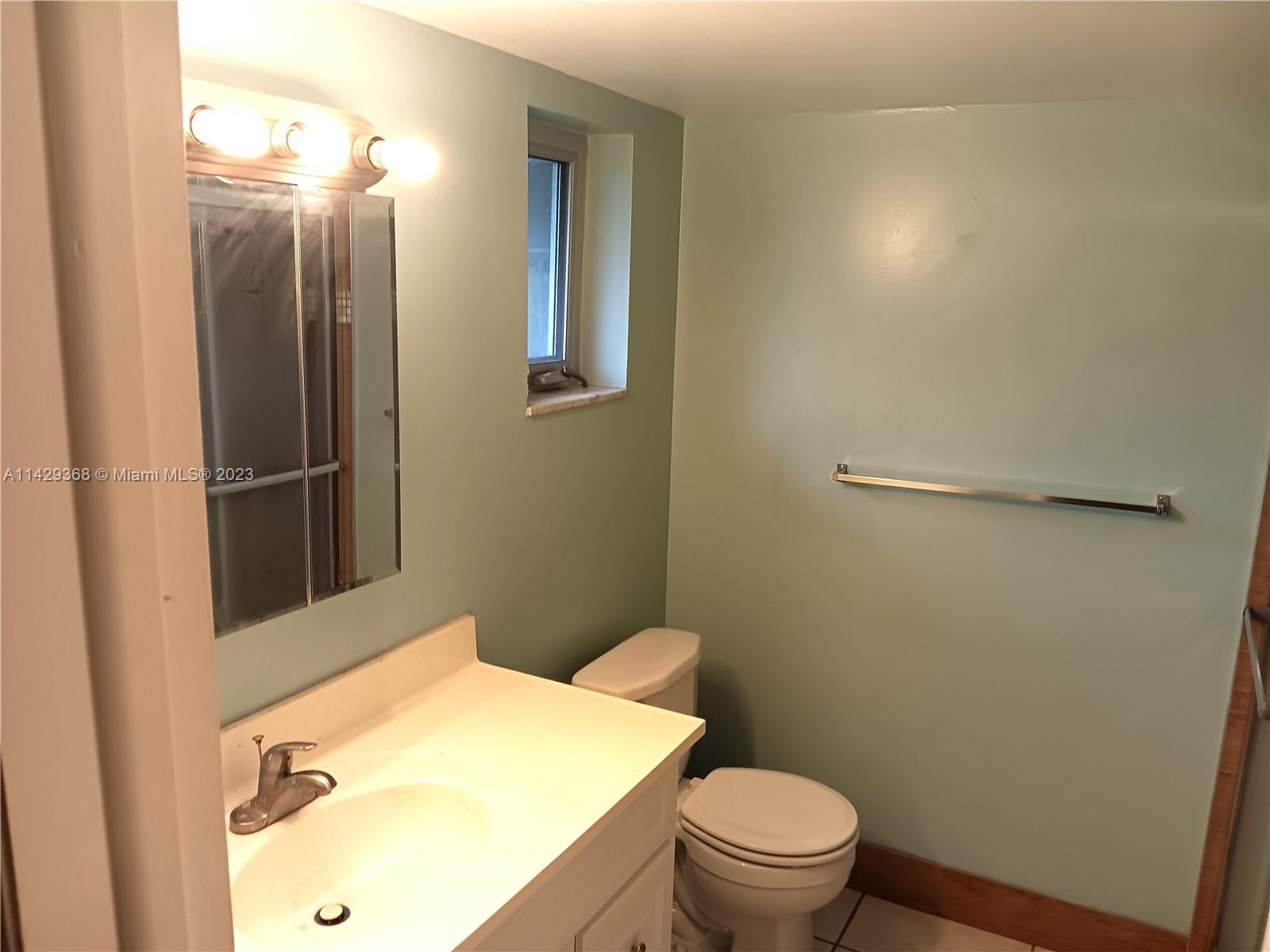 5790 Stirling Road, Unit 311 Hollywood, FL 33021 - Photo 17 of 36 a bathroom with a toilet and a sink