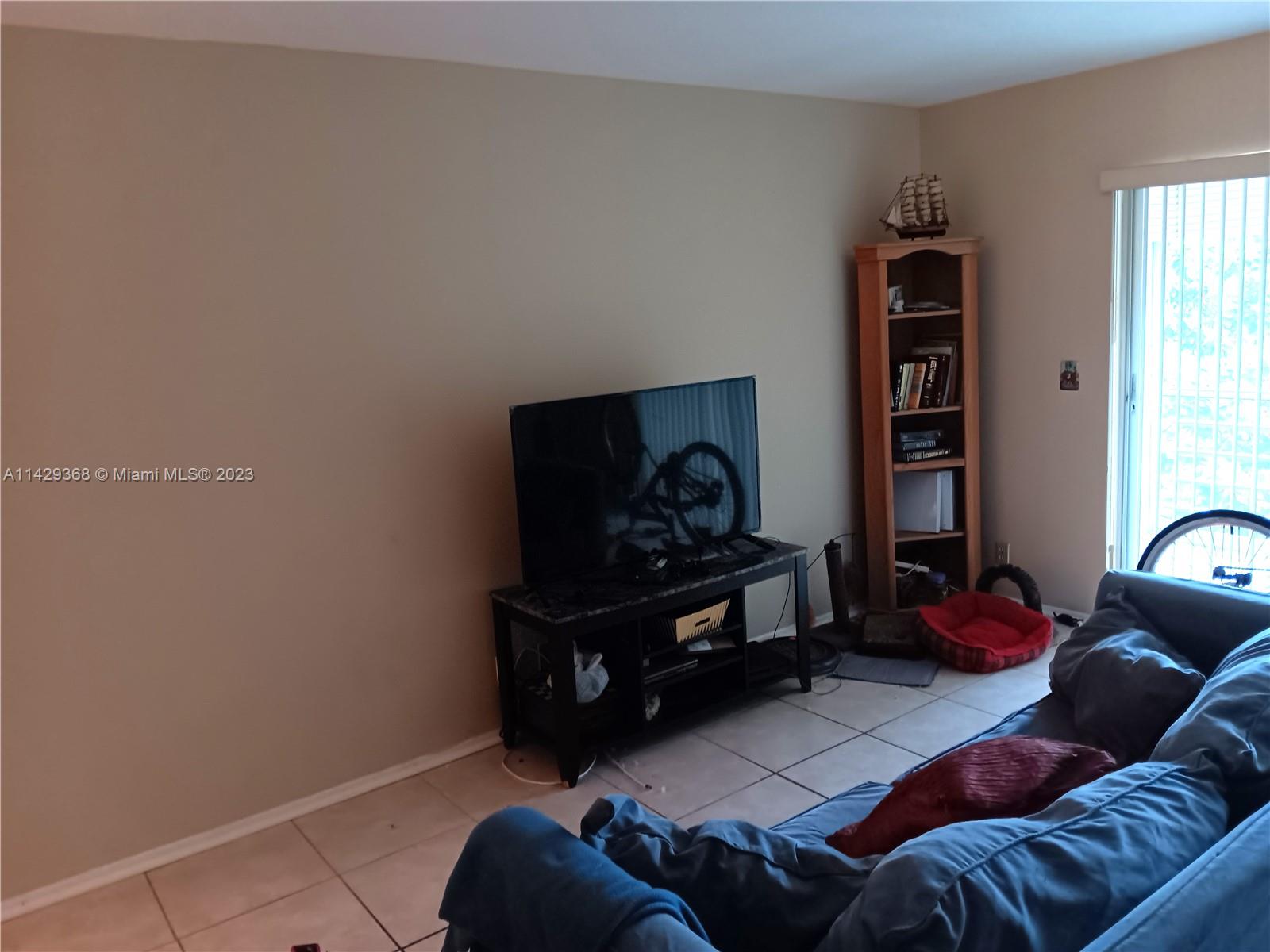 5790 Stirling Road, Unit 311 Hollywood, FL 33021 - Photo 18 of 36 a living room with furniture