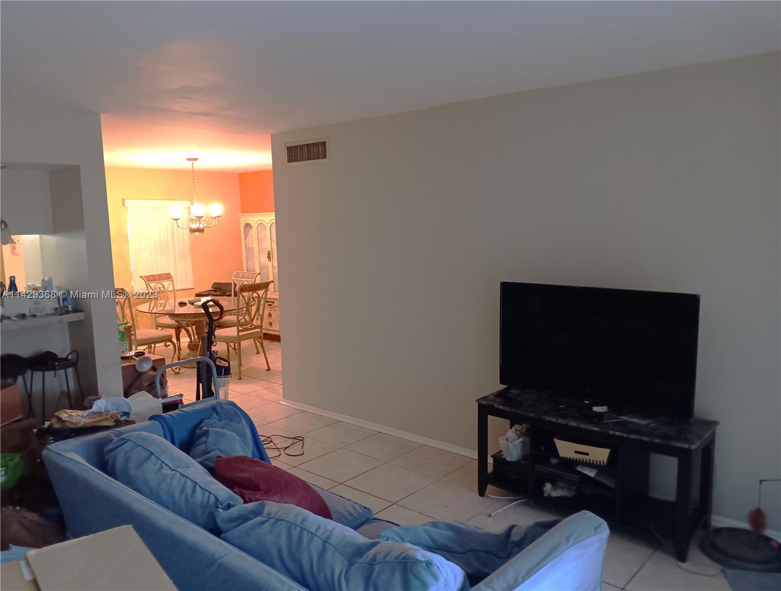 5790 Stirling Road, Unit 311 Hollywood, FL 33021 - Photo 19 of 36 a living room with furniture and a flat screen tv