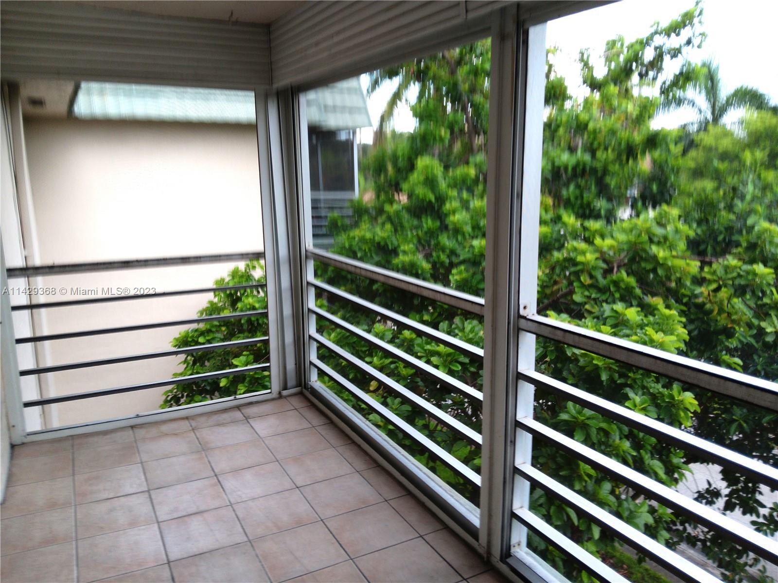 5790 Stirling Road, Unit 311 Hollywood, FL 33021 - Photo 20 of 36 a view of outdoor space with wooden floor and plants