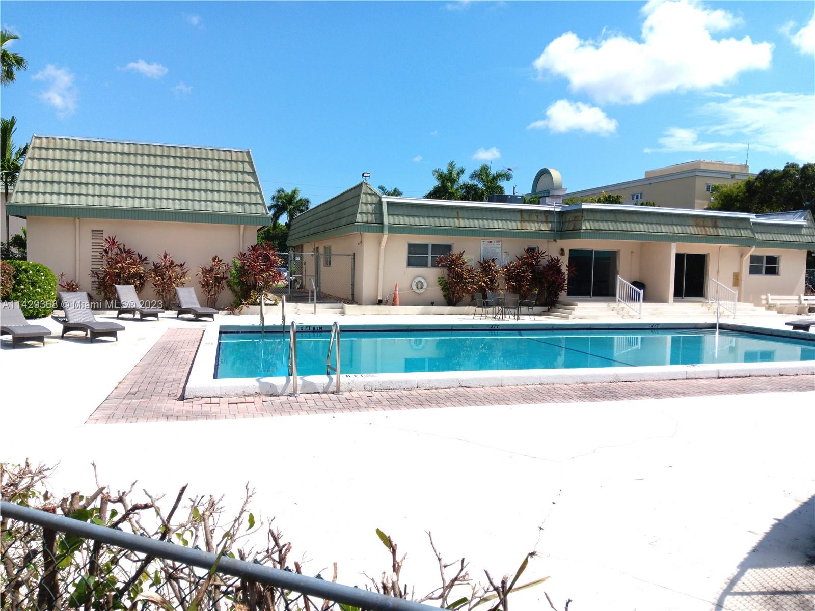 5790 Stirling Road, Unit 311 Hollywood, FL 33021 - Photo 2 of 36 a view of a house with a yard
