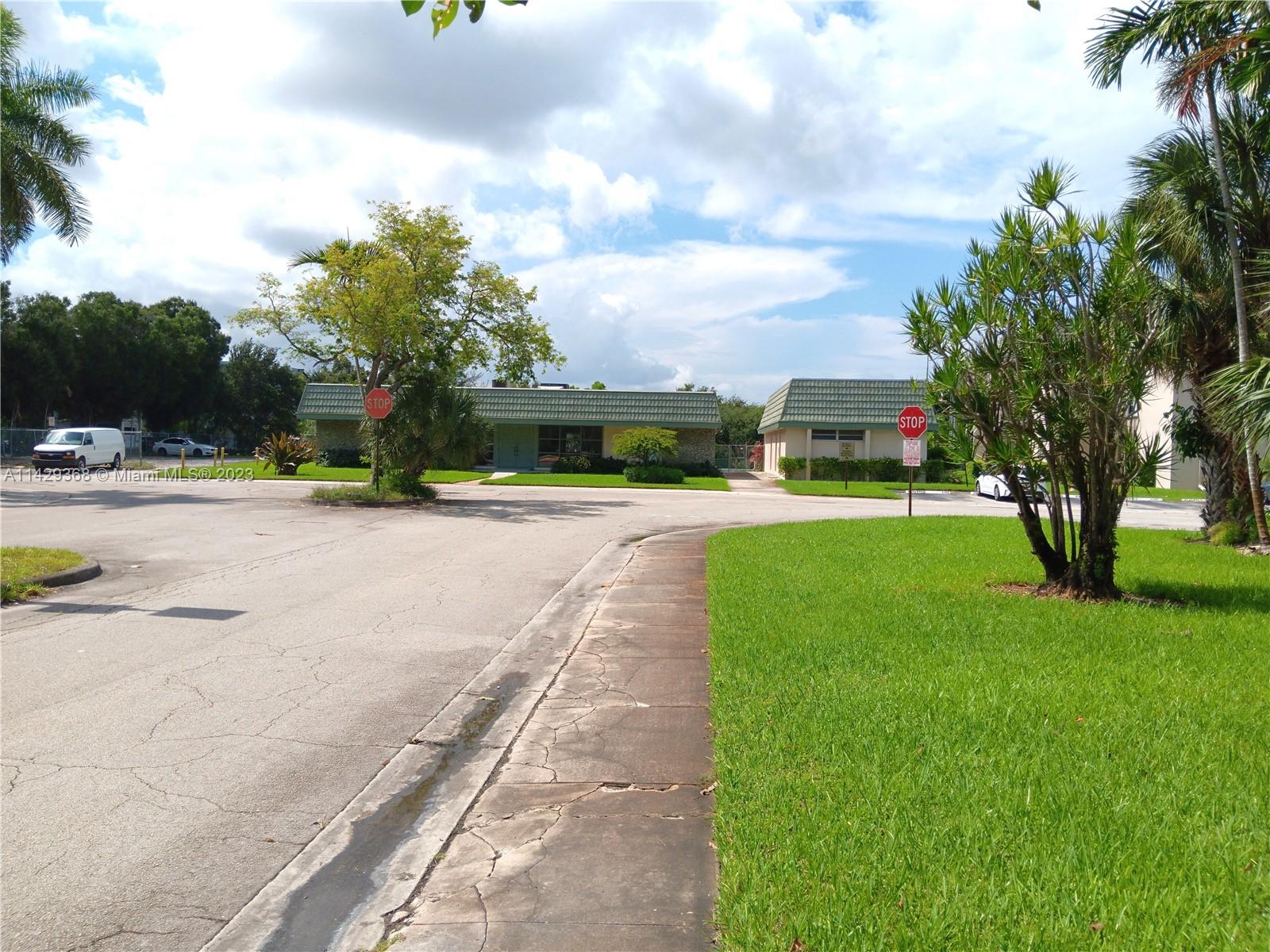 5790 Stirling Road, Unit 311 Hollywood, FL 33021 - Photo 26 of 36 a view of a park with palm trees