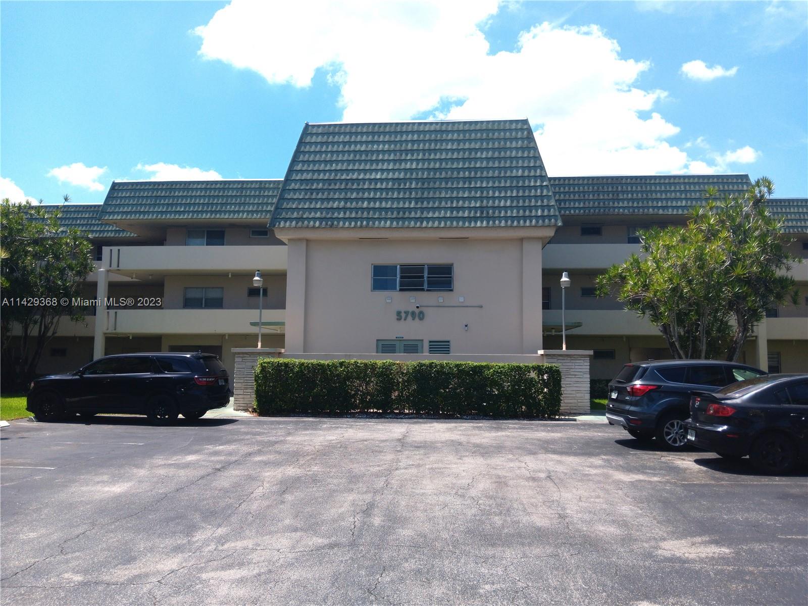 5790 Stirling Road, Unit 311 Hollywood, FL 33021 - Photo 29 of 36 a front view of a house with a yard