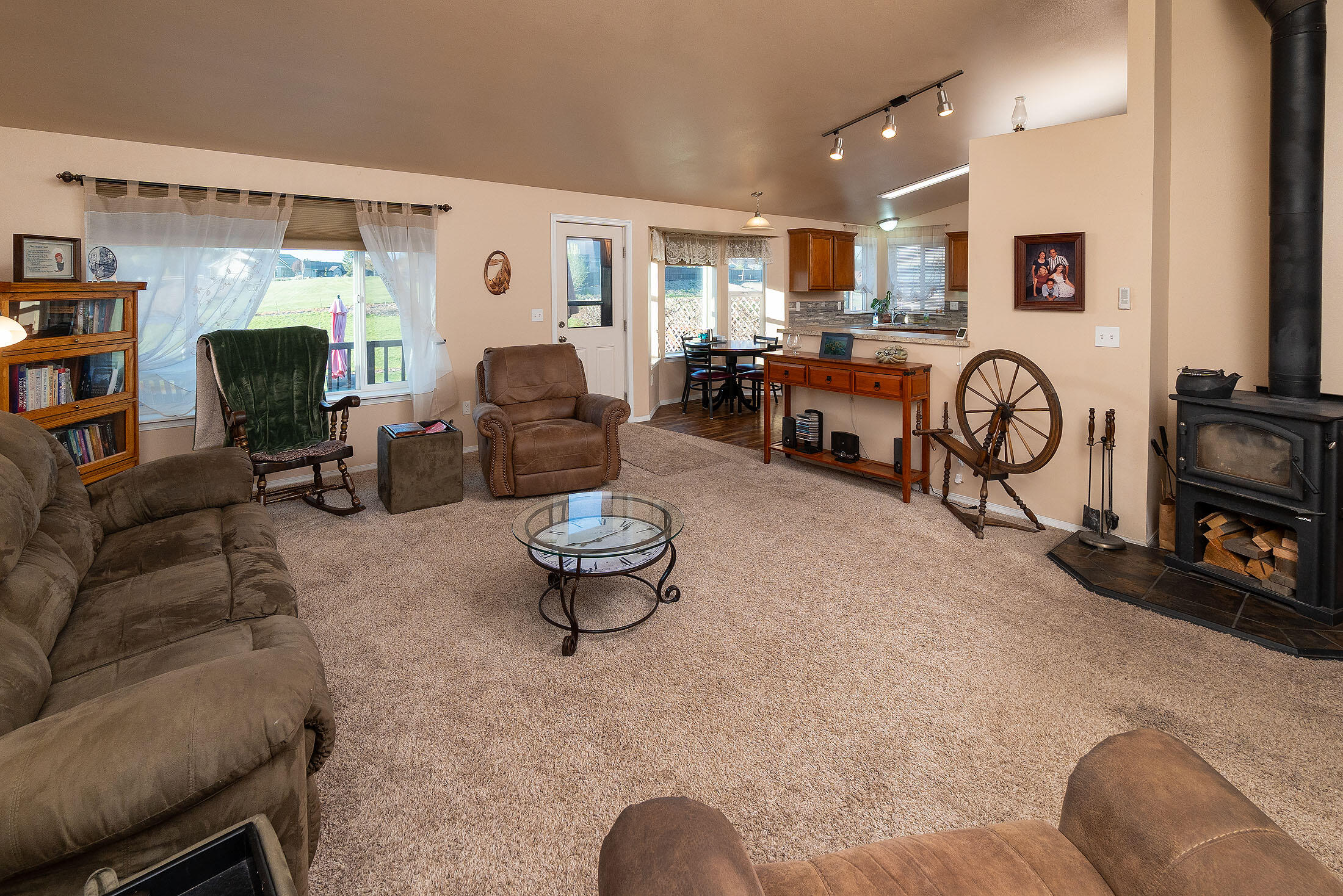411 Northwest Mc Donald Road Prineville, OR 97754 - Photo 6 of 47 Vaulted greatroom with cozy wood fireplace and large windows