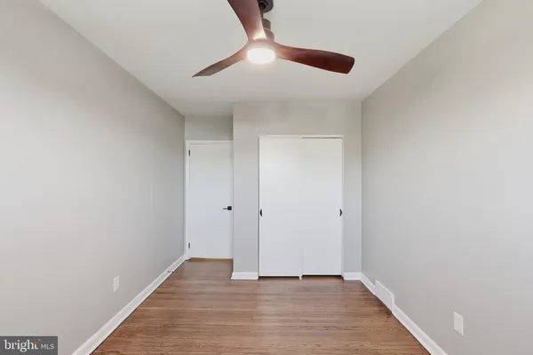 a view of an empty room and wooden floor