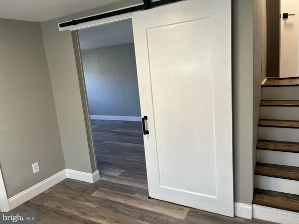 a view of front door with wooden floor