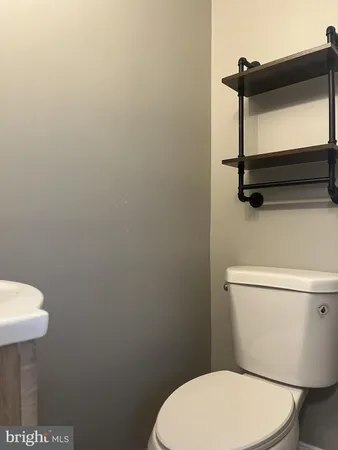 a bathroom with a toilet and a sink