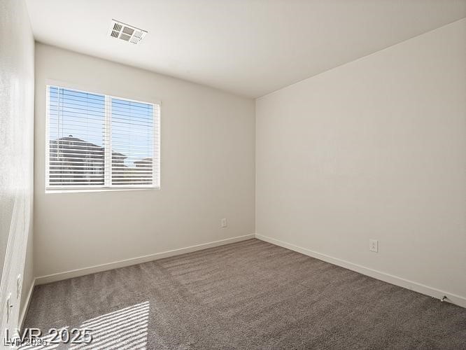 4675 Color Up Court, Unit 101 Las Vegas, NV 89122 - Photo 13 of 19 Spare room featuring carpet flooring and baseboards