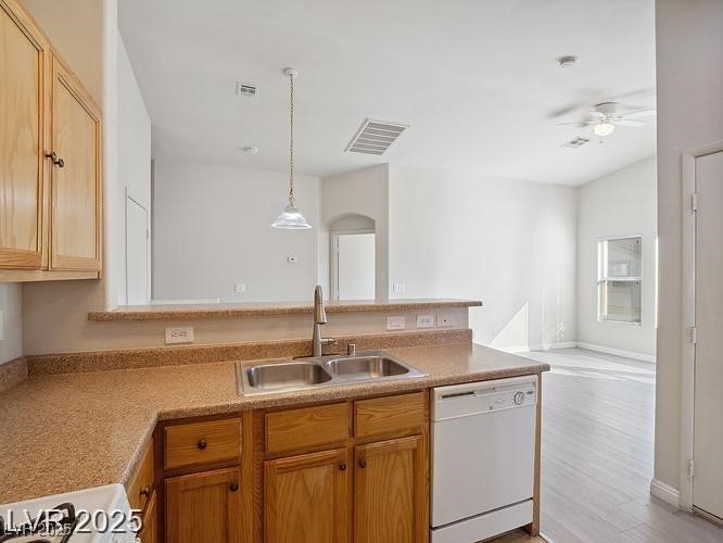 4675 Color Up Court, Unit 101 Las Vegas, NV 89122 - Photo 19 of 19 Kitchen with white appliances, a peninsula, light countertops, open floor plan, and pendant lighting