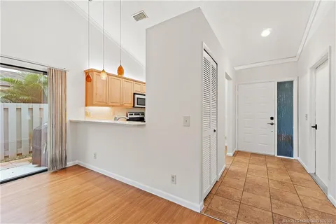 a bathroom with a double vanity sink a toilet and mirror
