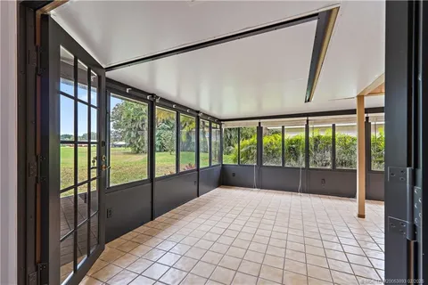 a view of an empty room with a large window