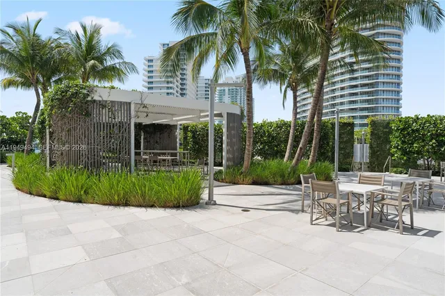 a view of a yard with a patio