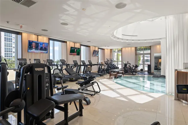 a view of a livingroom with furniture and dining room