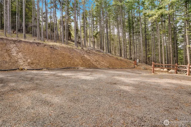 a view of a house with backyard wooden deck and sitting area