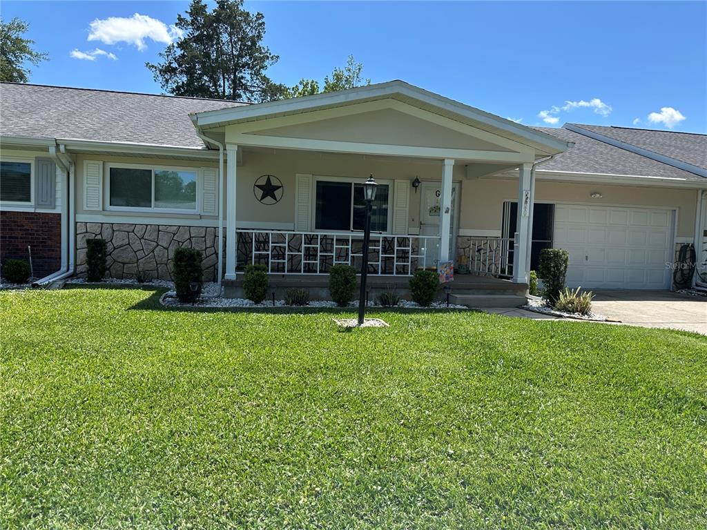8680 Southwest 94 Lane, Unit G Ocala, FL 34481 - Photo 1 of 24 front view of a house with a yard