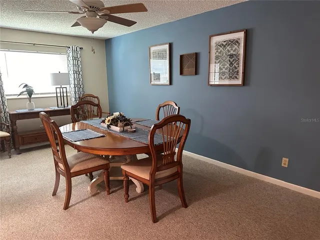 a dining room with furniture and window