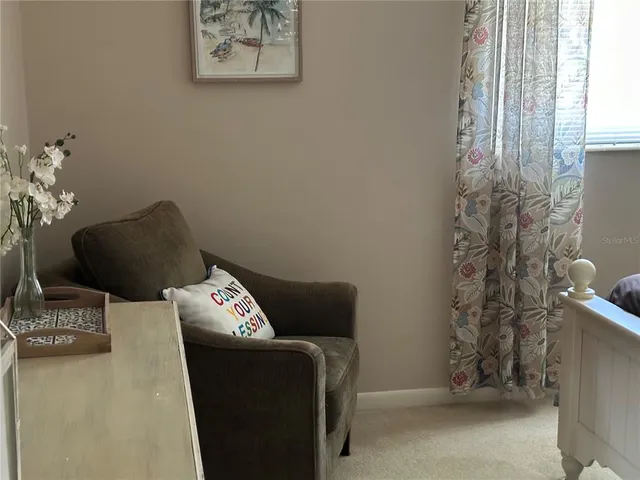 a blue and white sitting area with rug