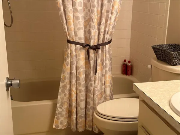 a bathroom with a toilet and a sink